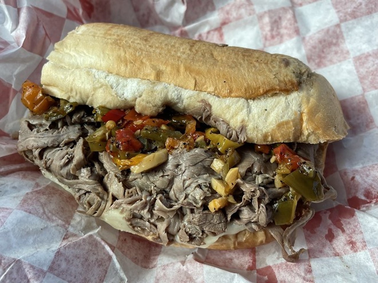 Italian Beef at Au Jus
Au Jus, 5875 Broadview Rd., Parma, 216-795-5063, aujus-cle.com 
It’s not every day that legends are born. With the opening of Au Jus in Parma, Cleveland’s Italian beef game immediately climbed to championship level. Wedged between a Marco’s Pizza and a nail salon in a dinky strip, the spotless kitchen flies through 150 pounds of slow-roasted top round beef per day. That tender shaved beef is piled into a hoagie bun, doused with gravy and topped with crisp giardiniera.