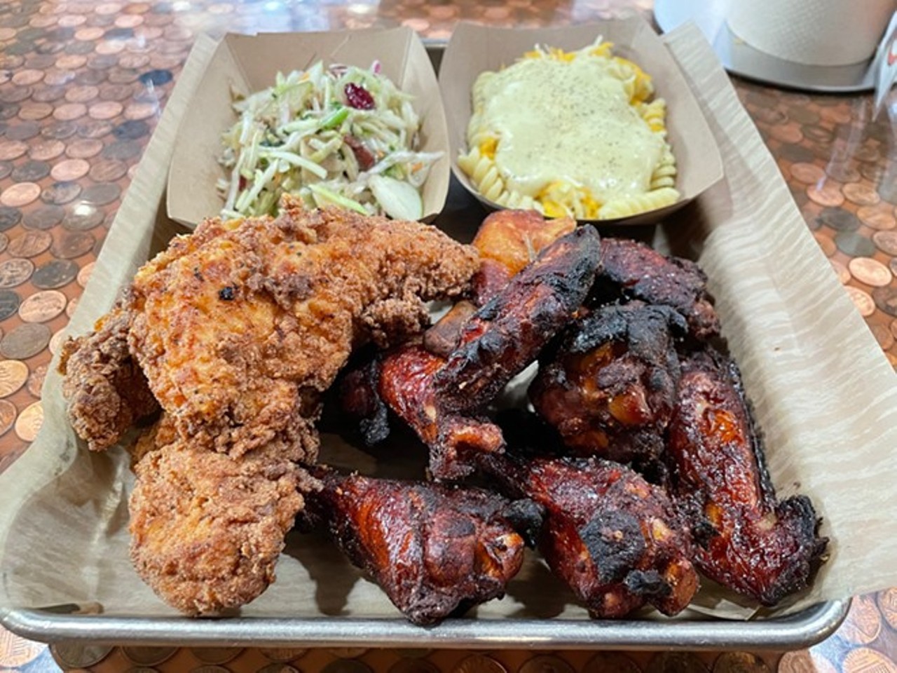  Boss ChickNBeer
120 Front St., Cuyahoga Falls
Location number four is in the works for Boss ChickNBeer, the justly praised chicken and beer restaurant owned by Heather Doeberling and Emily Moes. The pair opened the first shop in Berea back in 2018, added a spot in Bay Village in 2021, and expanded to Seven Hills the year after that. Next up is Front Street in downtown Cuyahoga Falls. The restaurant will be located in the recently approved DORA district, which allows pedestrians to walk around with alcoholic beverages. The new restaurant will be open sometime this fall. When it does, it will be the largest location to date, with seating for 48 indoors, a 24-seat patio, and the signature penny-topped bar.
