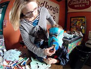 The next generation of Los Straitjackets fans made their own masks for the band's all ages show at the Beachland. - WANDA SANTOS-BRAY