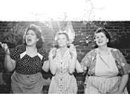 Three Italian American housewives keep the home - fires burning during the wartime summer of 1945.