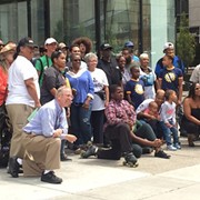 Group of Mostly Black Detroit Residents Takes Photo at Site of Dan Gilbert's Controversial Ad