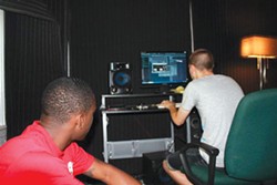 Tezo and Nate Fox in a home studio in 2007.