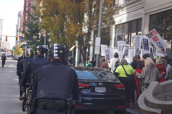 Cleveland police officers on bikes followed protesters as they marched; Refuse Fascism Protest & March (11/4/2017). - SAM ALLARD / SCENE