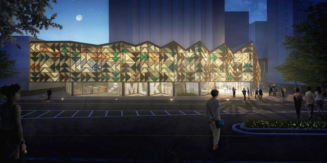 An exterior night view of the MASS & LDA proposal for the Cleveland Public Library's new Martin Luther King Jr. Branch as viewed from across Euclid Avenue east of East 105th Street. - MASS & LDA