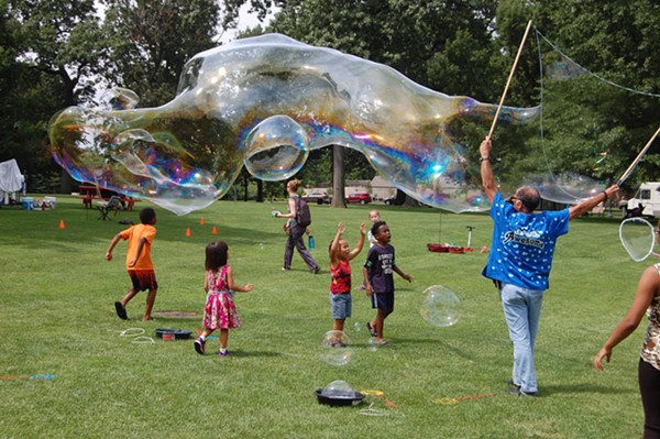 Children enjoy the bubble demonstrations on Founders' Day. - University Circle Inc.