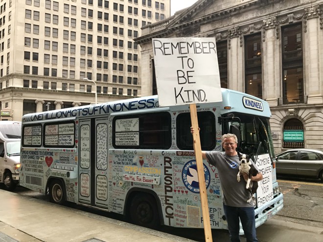 Bob Votruba and his dog, Bogart, stand in front of the Kindness Bus. - ALEXANDRA SOBCZAK