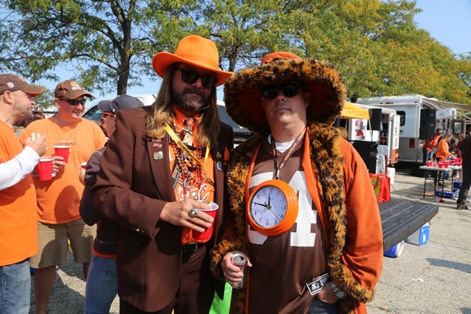 Some Browns fans showing off their best stuff in the Muni Lot. - PHOTO BY EMANUEL WALLACE