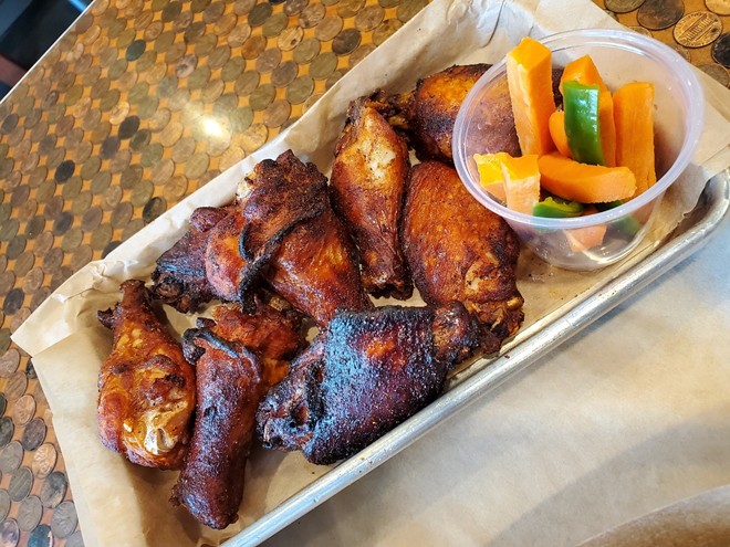Fried chicken wings are the specialty of the house at Boss ChicknBeer. - Courtesy Heather Doeberling