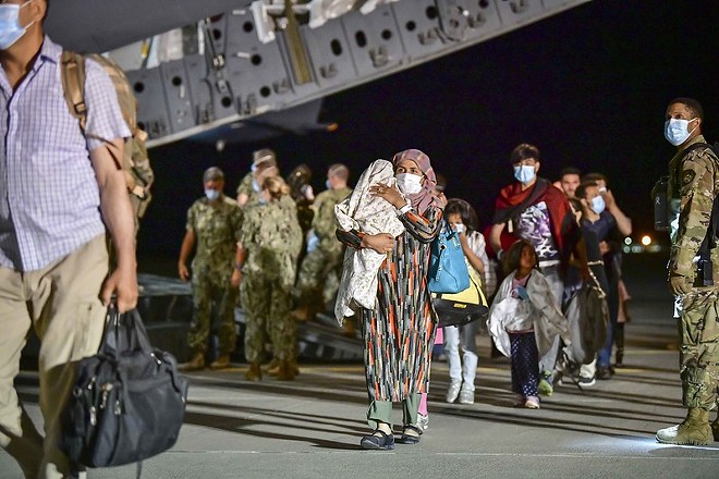 Afghan evacuees disembark a U.S. Air Force C-17 Globemaster III at Naval Air Station Sigonella, Aug. 22, 2021. - COMMANDER, U.S. NAVAL FORCES EUROPE-AFRICA/U.S. 6TH FLEET, FLICKRCC