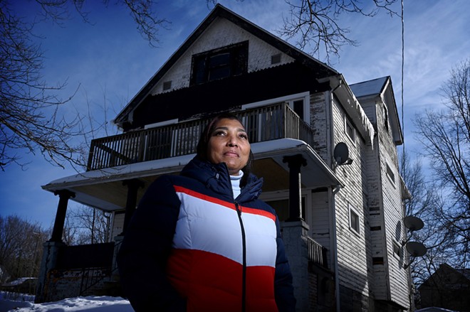 Tuesday Gibson outside her Buckeye-Woodhill home. Gibson didn’t complete Cleveland’s Exterior Paint Program, and she’s not alone. About 64 percent of applicants who were approved in 2020 and 2021 have not finished painting their homes. - Photo by Tim Harrison