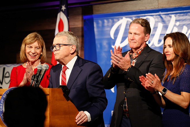 COLUMBUS, OH — MAY 03: Ohio Gov. Mike DeWine joined on stage by First Lady Fran DeWine, Lt. Gov. Jon Husted and Second Lady Tina Husted to celebrate DeWine winning the Republican Party nomination for governor in the Ohio primary election, May 3, 2022, at the DeWine-Husted campaign headquarters, Columbus, Ohio. - (Photo by Graham Stokes for the Ohio Capital Journal.)