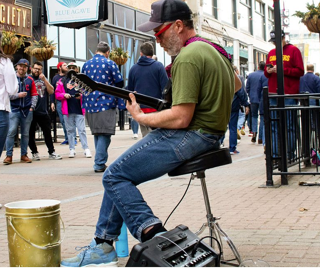 A local musician performs on 4ht Street. - Downtown Cleveland Alliance