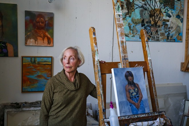 Artist Wally Kaplan, of Beachwood, stands in her studio at the ArtCraft Building, where she's worked for the past 15 years. - Photo / Mark Oprea
