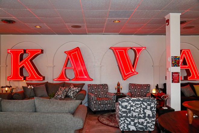Sacred Waters' lounge room. Owner David Kovatch bought four letters, seen here, from the now defunct Dave's Market. - Mark Oprea