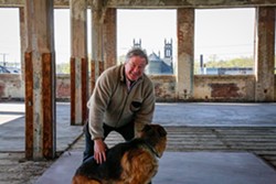 Shorey and his German Shepherd Paolo, on the third floor of 2469 East 71st., on Thursday. - Mark Oprea
