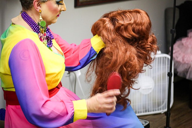 Veranda L’Ni preps her hair for Story Hour. - Photo by Mark Oprea