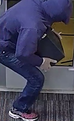 The Paystation Bandit, shown here, in CCTV footage provided by the library. - CPL Police
