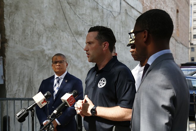 Mayor Bibb and the U.S. Marshals at the announcement of 25-year-old Jaylon Jenning's arrest, two days after Jenning open fire on West 6th Street at two o'clock in the morning. - Mark Oprea