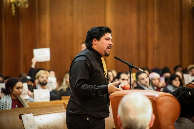 Juan Collado Díaz, a 23-year-old community organizer, has been helping to rally support for Cleveland's passing of a resolution since October. - Mark Oprea