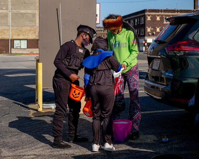 On Halloween, Diamond, along with a group of friends and local activists, parked their cars in the lot across from East Cleveland City Hall and handed out candy and groceries to families passing by. - Michael Indriolo for The Marshall Project