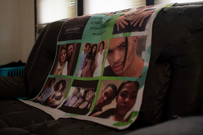 Diamond hung the blanket printed with photos of her and Vincent next to her bed. The center of the blanket reads, “Our siblings are there with us from the dawn of our personal stories to the inevitable dusk.” - Michael Indriolo for The Marshall Project