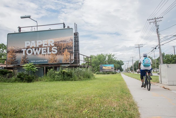 Two of Twist Creative's billboards seen around Cleveland, designed to provoke conversation. - Photo via Twist Creative/Facebook