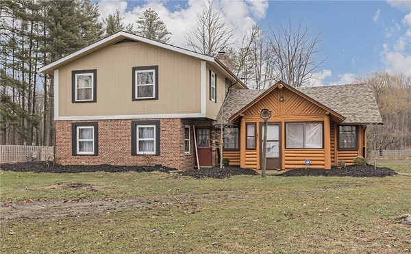 Suburban in Front, Rural Log Cabin in Back, This North Royalton Home is the Mullet House of Real Estate