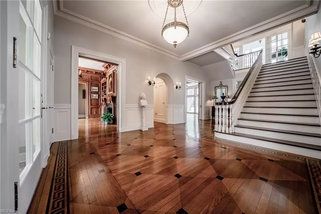 This Stately Lakefront Mansion In Edgewater Has a Sauna, Elevator and