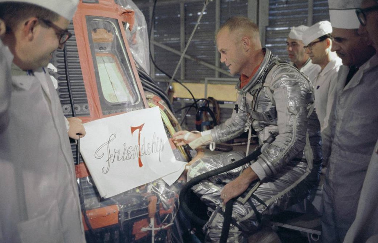 Astronaut John Glenn inspects artwork that will be painted on the outside of his Mercury spacecraft, which he nicknamed Friendship 7.