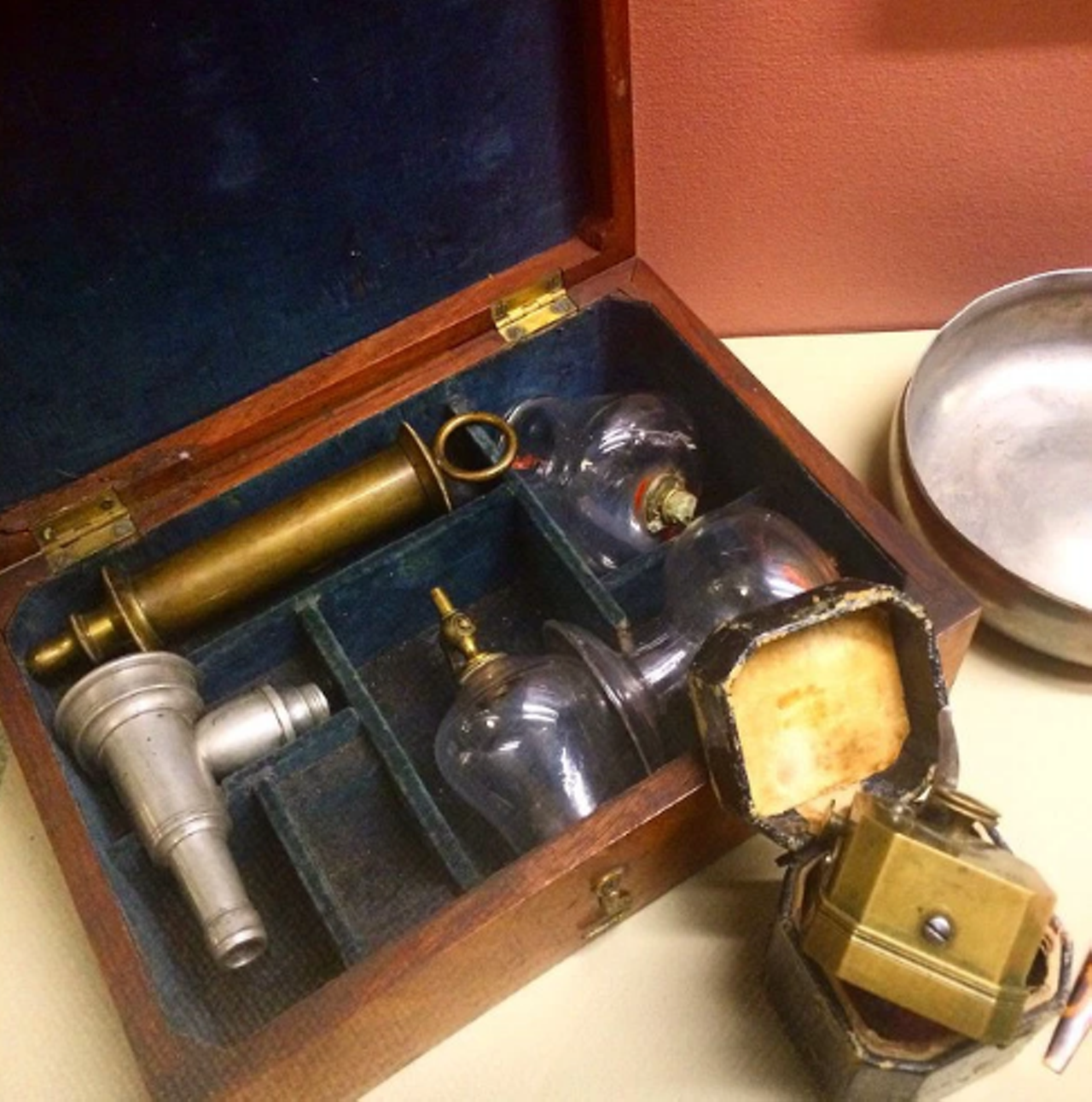 Cupping set and scarificator (c. 1860) to relieve humoral imbalances and improve health.