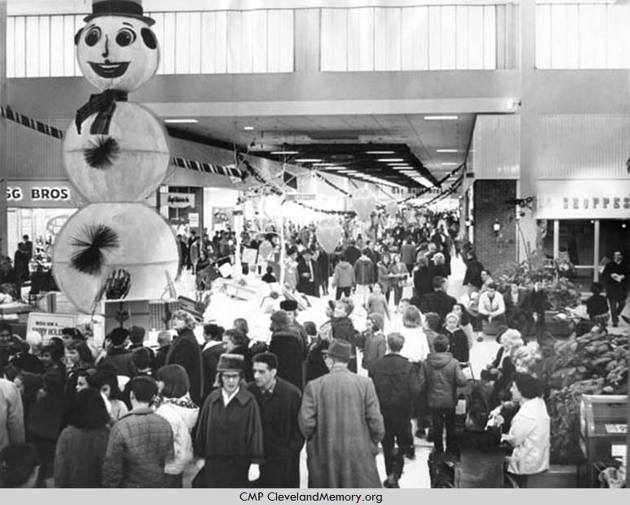 Crowds celebrate the holidays at festively decorated Severance Shopping center in Cleveland Heights, Ohio. 1964