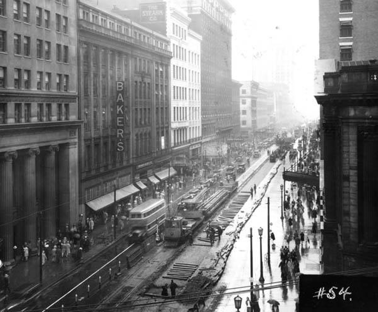 View of East 9th and Euclid looking east. Work is being done on the rails on Euclid Avenue, 1929